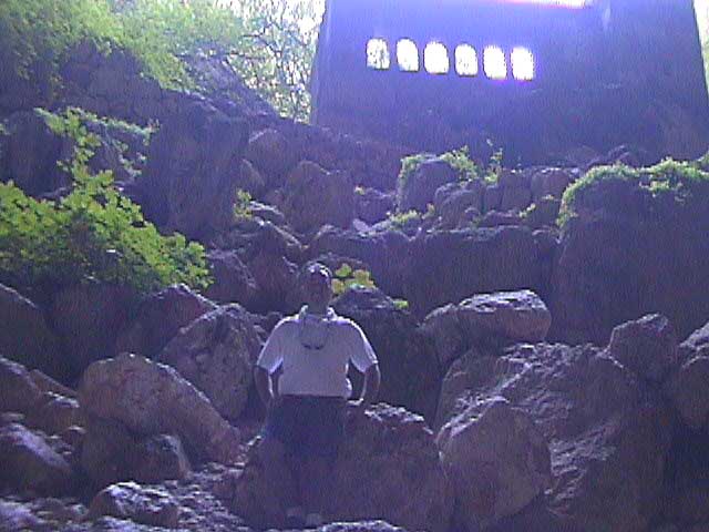 A view out from inside the cave through the church.